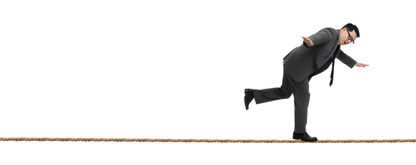 Risks and challenges of owning business. Man balancing on rope against white background, banner...