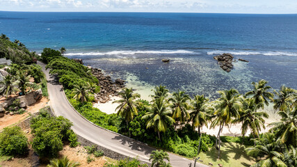 panoramic view from a drone of the sea bays and beaches on a sunny day of the Seychelles islands
