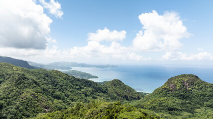 panoramic view from a drone of the sea bays and beaches on a sunny day of the Seychelles islands