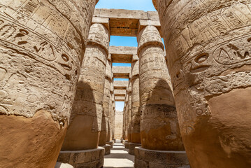 Rows of massive columns in Karnak temple in Luxor, Egypt - 753040043