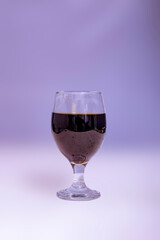 Glass of tasty dark wine Glass