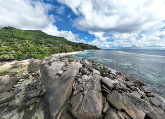 panoramic view from a drone of the sea bays and beaches on a sunny day of the Seychelles islands