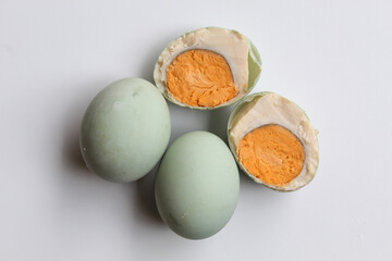 Halved salted egg, blue color shell from duck egg. Isolated on white background, flat lay or top view
