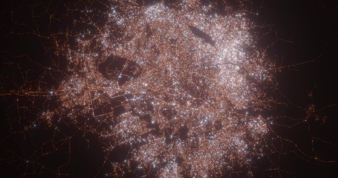 Ibadan (Nigeria) aerial view at night. Top view on modern city with street lights. Camera is zooming out, rotating counterclockwise. Vertical video. The north is on the left side