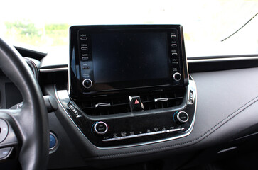 Modern car Screen multimedia system. Panel of a modern car. Interior of a modern luxury car.  Modern car dashboard.