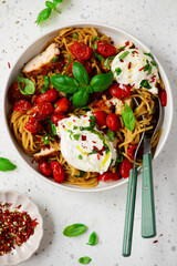 Chicken spaghetti with burrata cheese ,cherry tomatoes and lemon butter  garlic sauce.top veiw .