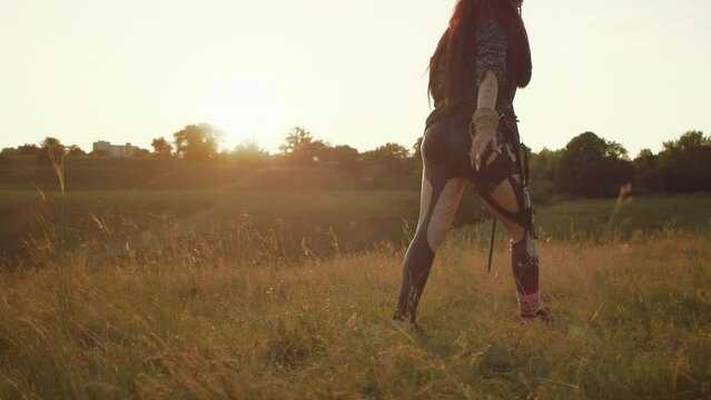 In a field of blooming flowers, beneath the watchful gaze of an owl, women adorned in vintage elegance revive ancient rituals, their voices a whisper to the spirits.