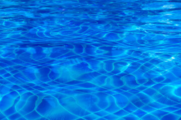 Swimming Pool Surface With Light Reflection and Water Ripple Patterns