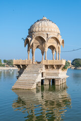 Gadsisar Sagar Lake with historic buildings to store rainwater and ensure a steady water supply for...