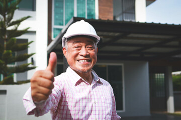 Home construction contractor gives thumbs up He smiled happily. Elderly engineer or architect...