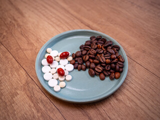 Medicines and coffee are two common ingredients in many people's lives. But should some medications never be mixed with coffee? - obrazy, fototapety, plakaty