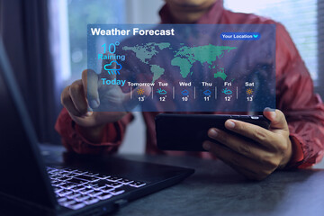 Man wearing rain coat using application on smartphone to weather forecast before going out home...