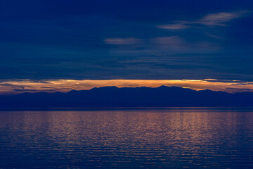 Serenity at sundown. Captivating reflections in the Aegean sea.
