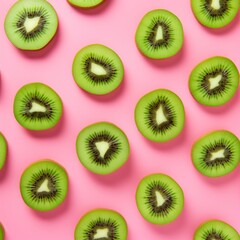 Fototapeta premium Slices of kiwi on pink background. Flat lay. Kiwi pattern for design.