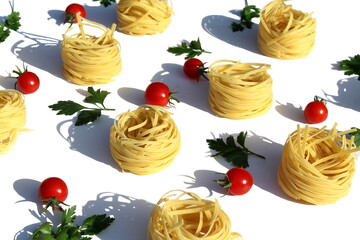 Texture of pasta in the form of a nest on a white background.	