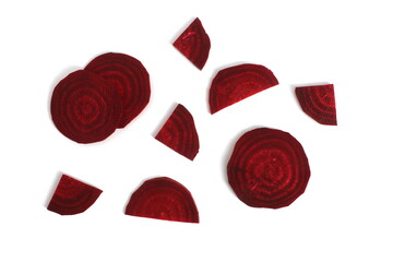 Sliced red raw beets lie on a white background.	