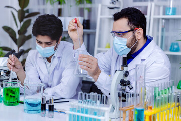 Scientist and people in science exam, test or group project in experiment or assignment at laboratory. Scientist or pharmacist work in scientific lab. Medical Development Laboratory.