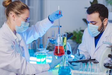 Scientist and people in science exam, test or group project in experiment or assignment at...