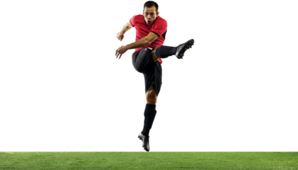 Champion. Young guy, soccer player in red and black uniform training, hitting ball with leg isolated on transparent background. Concept of sport, game, competition, championship, active lifestyle
