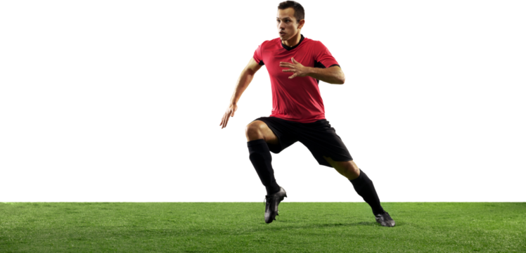 Dynamic image of young man in black uniform, soccer player playing, dribbling ball isolated on transparent background. Concept of sport, game, competition, championship, active lifestyle