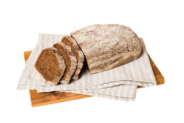 Assortment of freshly sliced baked bread with napkin isolated on white background. Healthy unleavened bread. French bread slice