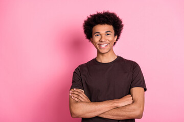 Portrait of happy young student wavy hair guy confident smiling and looking at you folded hands...