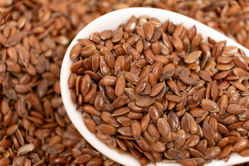 Flax seeds in a spoon macro