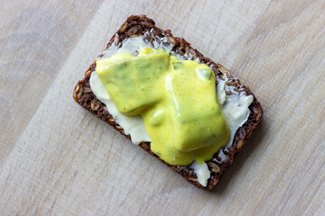 dark bread with butter and curry herring