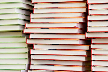 Fototapeta premium Load of knowledge. A large pile of new books in hardcover