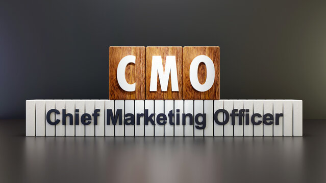 Text abbreviation CMO - Chief Marketing Officer on wooden cube, black background