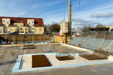 Construction site with the start of foundation work of a large building.Tower crane and prepared...