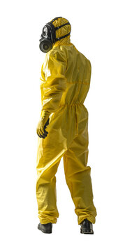 Person in a full yellow hazmat suit and gas mask standing