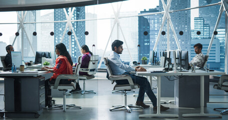 Team of Talented Young Indian Professionals Working in a Business Research and Development Agency....