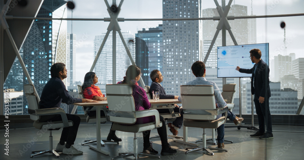 Aufkleber young indian businessman holds a presentation for a diverse group of business partners. manager uses