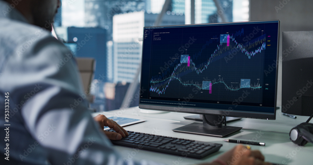 Poster hedge fund office: indian financial analyst using computer with display showing real-time stocks, ex