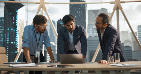 Cinematic Footage of a Successful Indian CEO Making a Presentation on a Laptop to a Board of Directors During a Corporate Meeting. South Asian Business Partners Discussing International Markets