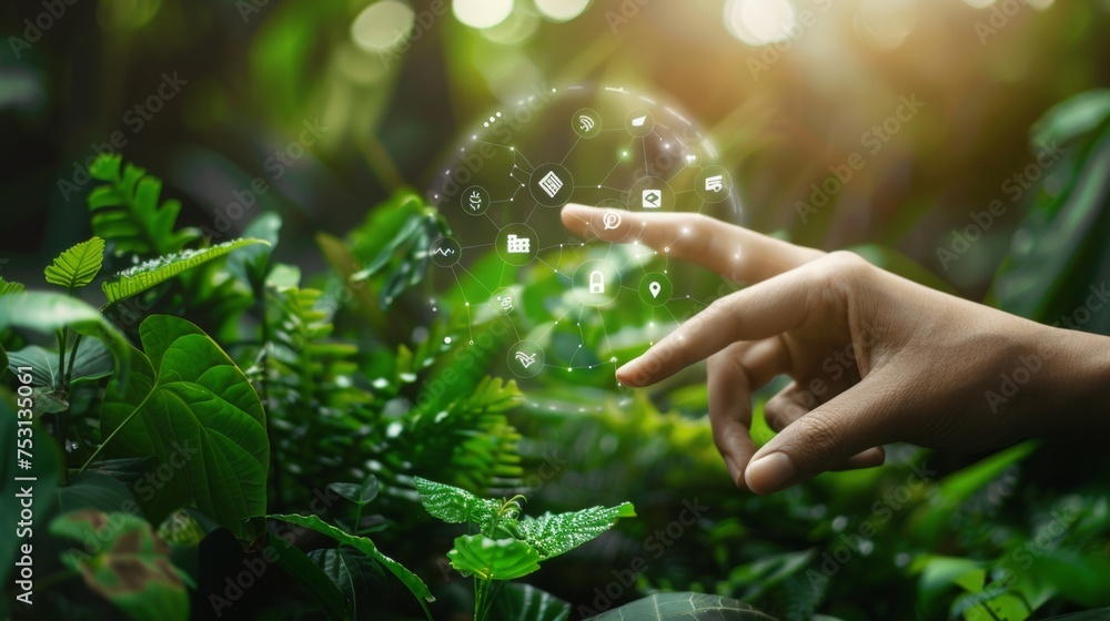 Fototapete a finger touch with environment icons across a network connection on a nature background.