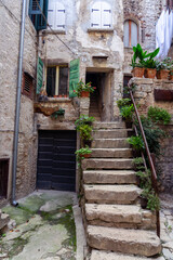 Fototapeta na wymiar beautiful street of Rovinj Croatia with cobblestone and colorful shutters