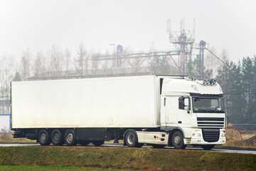 Professional truck drivers delivering cargo on highway