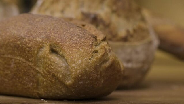 loaf of freshly handmade bread on the table, close up traveling, 