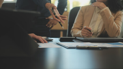 Business team collaboration discussing working analyzing with financial data and marketing growth report graph in team, presentation and brainstorming to strategy planning making profit of company.