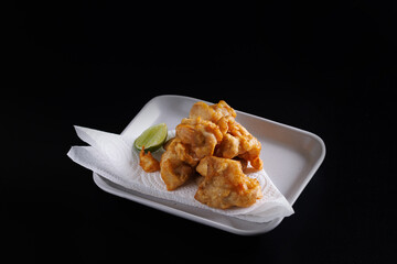 Chicken Karaage Japanese Fried chicken isolated in black background