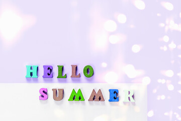 Hello Summer - text from the letters on violet background.