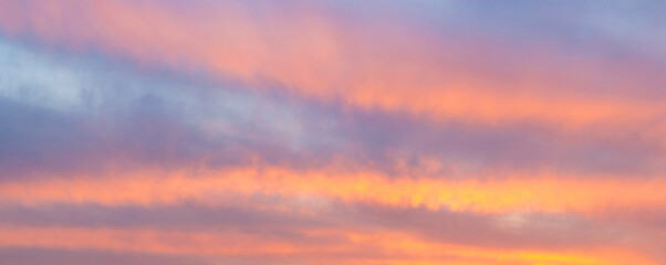 Evening sky with red streaks of cloud