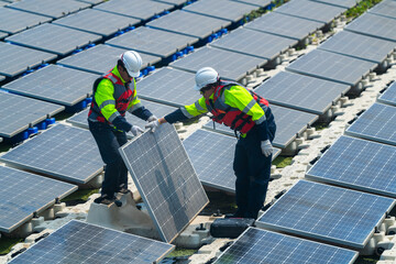 Photovoltaic engineers work on floating photovoltaics. workers Inspect and repair the solar panel equipment floating on water. Engineer working setup Floating solar panels Platform system on the lake.