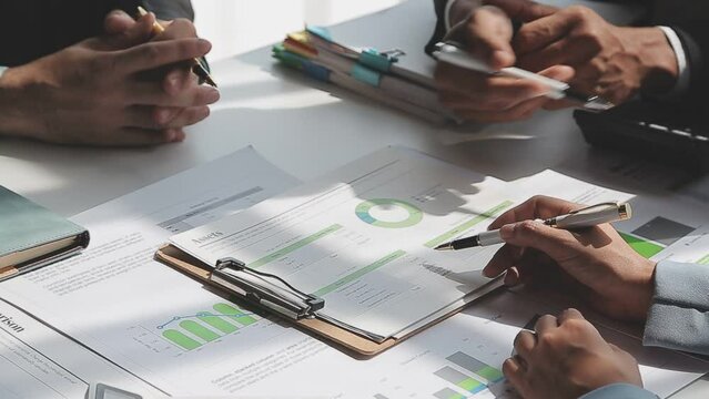 Business team collaboration discussing working analyzing with financial data and marketing growth report graph in team, presentation and brainstorming to strategy planning making profit of company.
