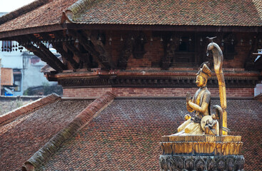 Real art masterpiece in old temple - statue of Yoga Narendra Malla or Yoganarendra with cobra snake...