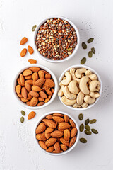 Obraz na płótnie Canvas A minimalist setup of nuts and seeds, highlighting healthy fats, isolated on a white background to suggest smart snacking options