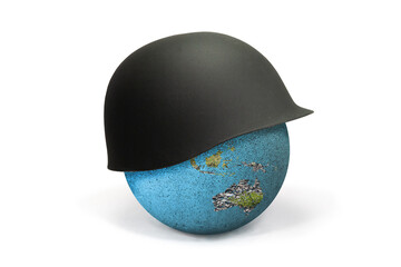 Earth Globe covered with a soldier's helmet showing Africa and Australia: war concept. The...