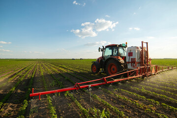 Spraying pesticides at soy bean fields